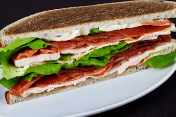 blt sandwich; a tasty breakfast, lunch, or snack; with meat and vegetables