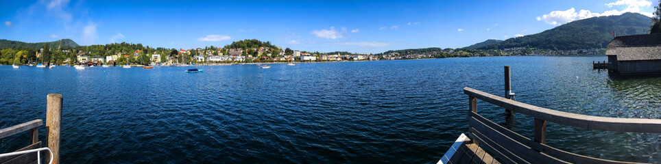 photo background, panoramic view of the lake, wooden jetty without people, and mountains, in the Alps in Austria, Europe