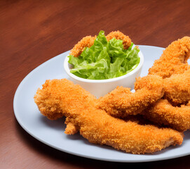 picture of chicken tenders, made of processed meat, a tasty fast food, savory