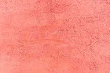 Abstract background of red textured plaster