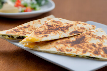 cheese quesadilla, a fatty snack food item, juicy and delicious, ready fast food