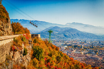 Grenoble France 11/2021 vue de Grenoble depuis les hauteurs de la bastille, célèbre pour son téléphérique appelé les bulles de Grenoble. - obrazy, fototapety, plakaty