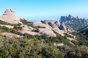 Fototapeta premium Clusters of towering rock in a mountain landscape . Natural park of Montserrat Catalonia Spain