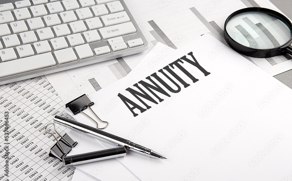 Poster annuity text on paper with chart and keyboard, business concept