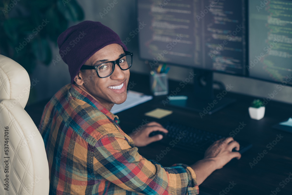 Poster profile photo of cheerful front end developer sitting chair keyboard typing operating server indoors