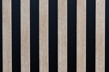 Wooden slats on black wood for use as a background or texture