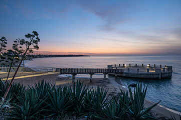 the roundabout overlooking the sea and the beach of Avola with the splendid colors of sunrise