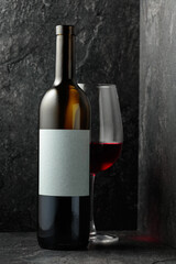Red wine on a black stone background.