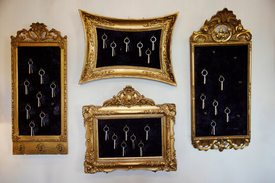 Hotel keys hanging inside picture frames