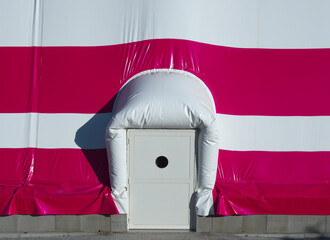 Emergency exit from inflatable air dome for football field