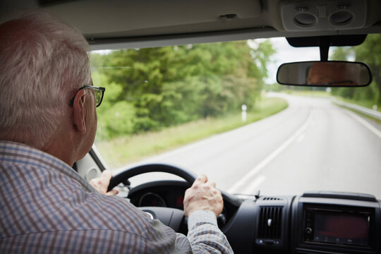 Senior man driving van