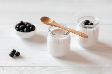 Two portions of blueberry yoghurt, side view