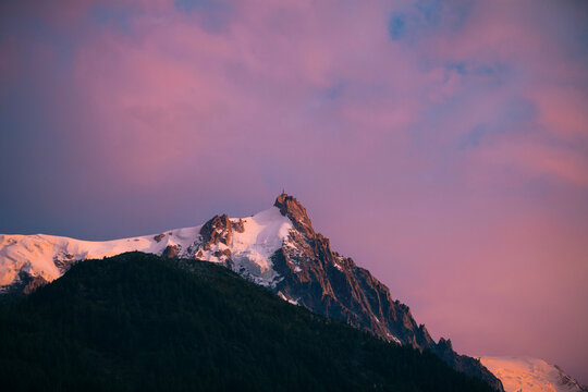 Snowcapped peak against purple sky