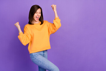 Photo of young attractive cute woman wear orange sweater excited thumbs up celebrate big winter...