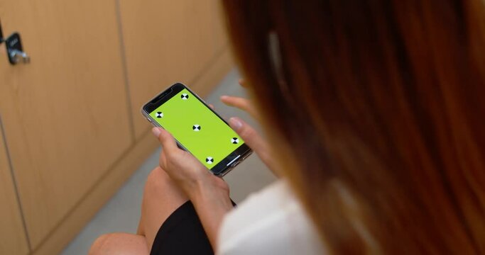Girl using a smartphone with tracking markers