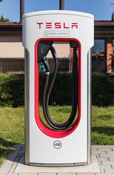 VESTEC, CZECH REPUBLIC - JULY, 19, 2022. Supercharger Tesla station. Supercharger charging station for electromobiles. Tesla cars park at the Tesla Supercharger.