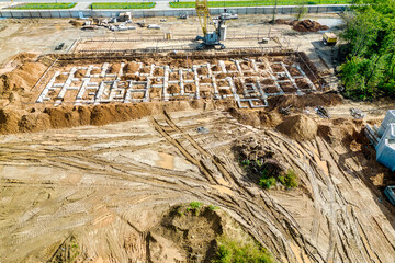 The initial stage of construction of a prefabricated reinforced concrete house. Foundation...