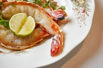 shrimp salad with lemon on a white plate