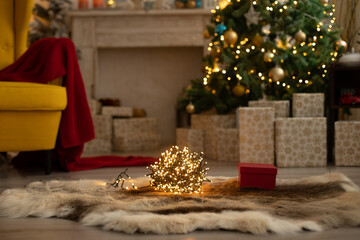 Cute child, boy, playing in a decorated room for Christmas