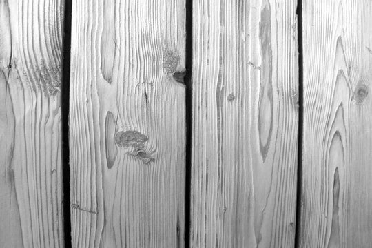 Black and white photo. Wood texture, old fence.