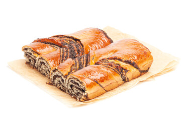 poppy seed strudel on a brown baking paper isolated on white