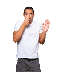 Fototapeta premium Concerned young man with a gesture of disgust