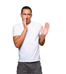 Fototapeta premium Concerned young man with a gesture of disgust