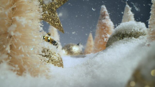 Super slow motion of falling snow with Christmas glass balls. Camera movement on slider. Filmed on high speed cinema camera, 800 fps.