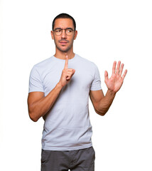 Haughty young man making a contemptuous gesture