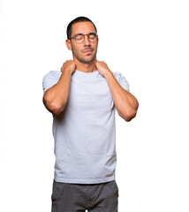 Fototapeta premium Concerned young man with a gesture of pain