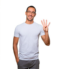 Naklejka premium Young man making a number four gesture