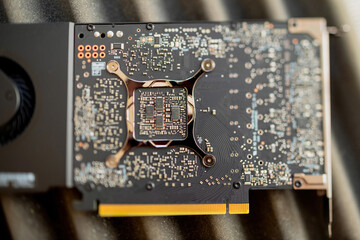 Close-up macro shot - tilt-shift lens used over detailed circuit board of a new powerful video...