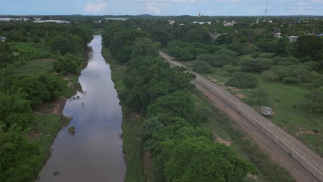 aerial shot of border fence construction between Haiti and Dominican Republic.4K