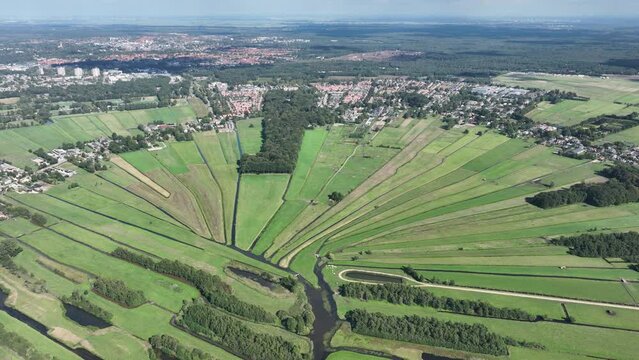 Loosdrecht recreational water river and meadow rural grass land green marsh in beautifull pattern small rivers and waters in nature. Dutch holland flat country side nature. Aerial drone.