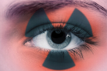 female eye with radioactive sign