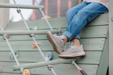 Little girl walks outdoors on sunny summer day. Joyful emotions. Joy of childhood. High quality photo