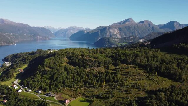 Drone view of the Stranda village surrounded by forests and mountains in Norway