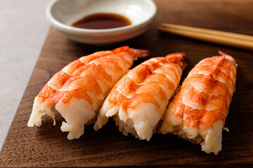 Black tiger prawn sushi topped with seafood
