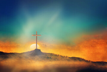 Shining cross on Calvary hill, sunrise, sunset sky background. Copy space. Ascension day concept. Christian Easter. Faith in Jesus Christ. Christianity. Church worship, salvation concept.  - obrazy, fototapety, plakaty