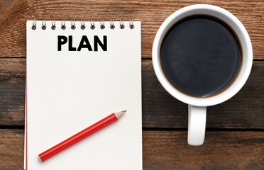 Plan words written in an office notebook. Concept in business. Plans for the new year.