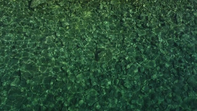 calm surface of the Adriatic sea captured by a low-flying drone, the archipelago of the island of Rab