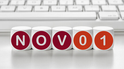 Letter dice in front of a keyboard - November 01