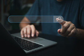 man hand searching browsing for information internet data Technology on computer keyboard notebook.SEO Search Engine Optimization.