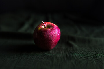 red apple on wooden background