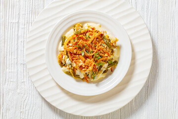 cheesy green bean casserole on plate, top view