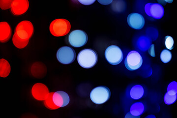 Blue and red bokeh in dark background