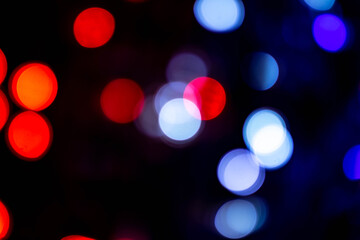 Blue and red bokeh in dark background