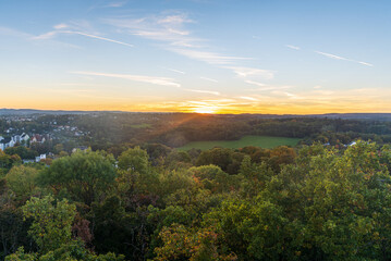 Fototapeta premium Last sunlight above Syratal from Lookout tower on Barenstein hill in Plauen city in Germany