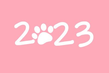 cat paw sticker with 2023 caption. Happy New Year 2023. Greeting card with text 2023. pink background
