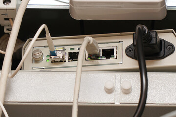 Network computer cables connected to a router or modem in the office